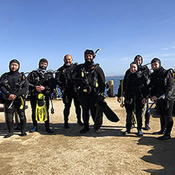 Scuba Fusion staff posing selfie at the Break Water San Carlos Beach Monterey